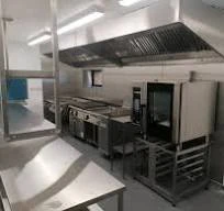 Clean commercial kitchen with canopy after professional cleaning