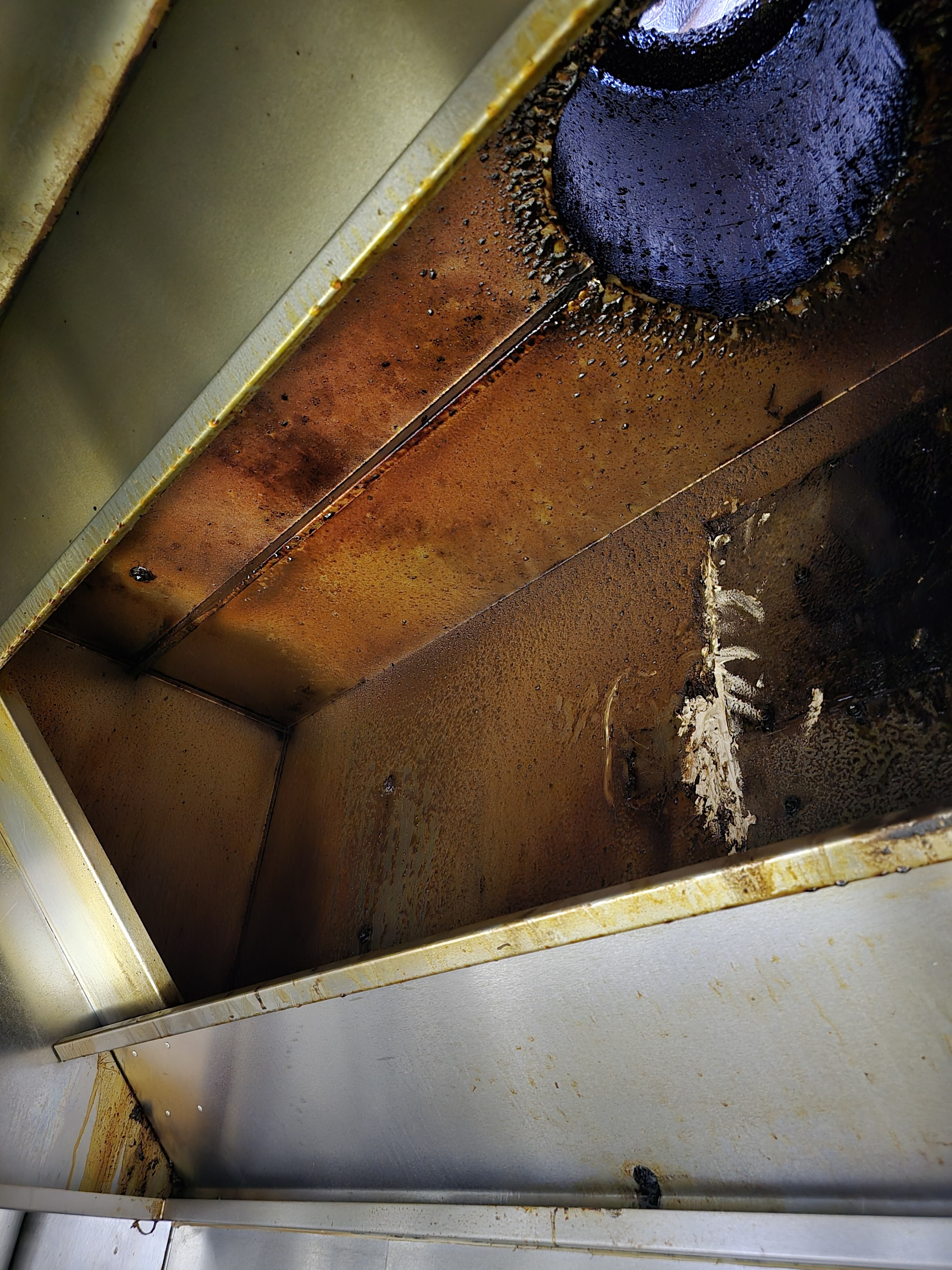 Grease and grime build-up around extraction fan - before cleaning